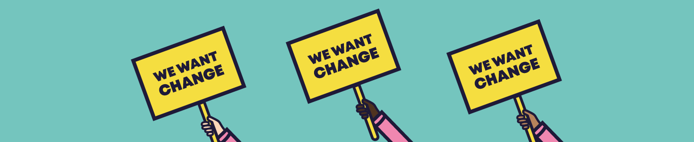 Three hands raised up holding placards. They each say 'We Want Change'.